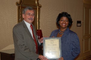 Balutis thanks Masada Johnson, executive assistant, American Appraisal Associates at luncheon held in October.